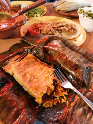 TAMAL DE HOJA DE PLÁTANO RELLENO CON SETAS ADOBO (tamale in banana leaf with adobo spices mushrooms!)  at Don Andres Taqueria Vegana in Mexico City