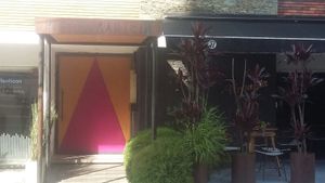 The yellow / red (closed) entrance of Restaurante //17 ... or Paralelo Diecesiete, Calle 8, Parque Poblado. at Paralelo Diecesiete 17 in Medellin