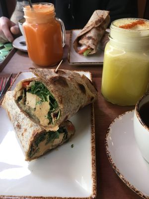Tofu wrap with grilled veggies & hummus + pineapple juice  at Juicy in Lisbon