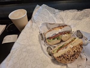 Everything bagel with green onion tofu schmear tomato red onion and lettuce and a vanilla latte with almond milk at Boss Bagel in San Antonio