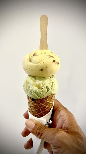 On top: spice pine nut and orange. On bottom: pandas gula Melaka. Come: whole wheat vegan waffle cone with a tasty chocolate stopper in the bottom. All together: delicious!!  at Kind Kones - Bangsar Village in Kuala Lumpur