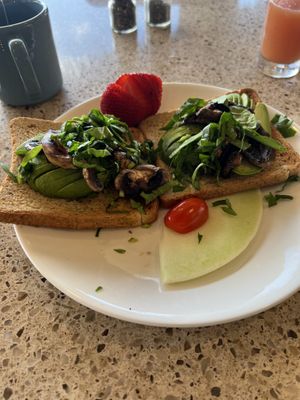 Avocado toast with mushrooms   at Ike's Bistro in Oranjestad
