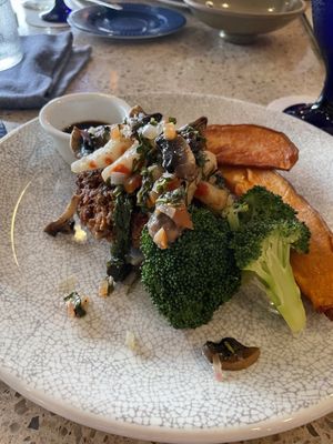 Lentil steak and “shrimp” with sweet potato’s. Delicious!   at Ike's Bistro in Oranjestad