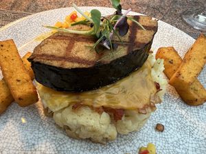 Soy fish on cauliflower gratin with fried polenta and corn salsa. Fish had amazing taste and texture   at Ike's Bistro in Oranjestad