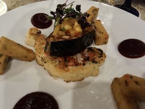 Vegan Soy Fish Filet with Cauliflower Steak and Polenta Fries  at Ike's Bistro in Oranjestad