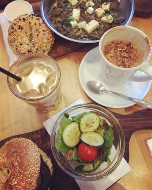 grilled aubergine sesame bagel and tofu shakshuka with an everything bagel. An oat milk iced latte and an oat milk mocha. at B Bagel Bakery Bar in South West London