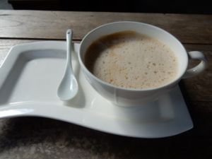 Coffee with coconut milk at Full Moon Wellness Cafe in Chiang Rai