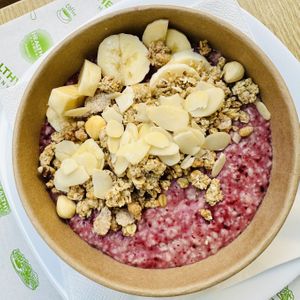 Porridge with forest fruits and banana  at Healthy Harmony Piraeus in Piraeus