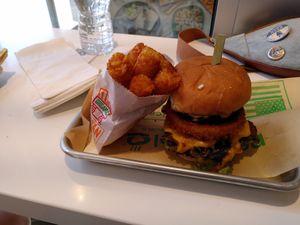 Maverick burger and tater tots at Next Level Burger - Brooklyn in Brooklyn