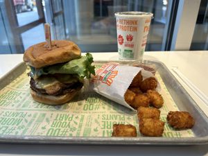 American Chzburger with double patty and tater tots  at Next Level Burger - Brooklyn in Brooklyn
