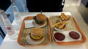 Sausage bacon and socal burgers, small oven baked fries and flavoured waters  at Next Level Burger - Brooklyn in Brooklyn