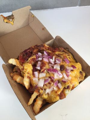 Chili Chz Fries - 3 Bean Chili, Melted Cheddar Style Cheese and Red Onion  at Next Level Burger - Brooklyn in Brooklyn