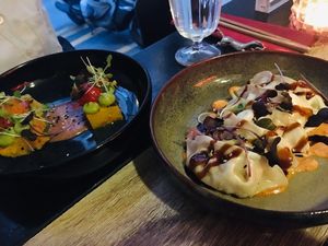 Left: funche (polenta base, black bean sauce); right: vegan gyoza at Marclee in Paris