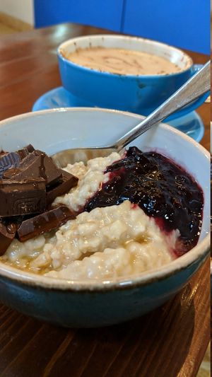 Dark chocolate, maple syrup and cherry compote. Oat milk mocha. at Bristol Porridge Project in Bristol