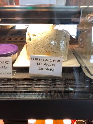 Sriracha Organic Black Beans  toasted on Farell’s Family Sourdough with sundried tomatoes & spinach. at 918 Coffee in Tulsa