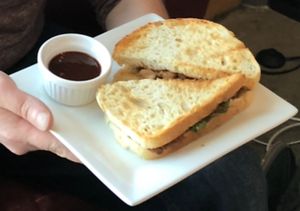 Housemate BBQ Jackfruit toasted in Farrell’s Family Sourdough with sundried tomatoes & spinach! at 918 Coffee in Tulsa