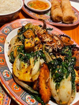 Sautéed vegetables with added tofu and spring rolls (nems chay) at Chez Tao in Quebec