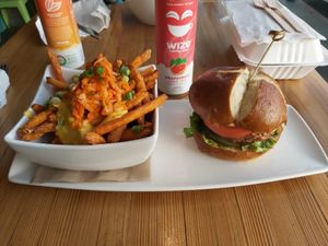 TMRW burger on pretzel bun w/ kimchi yam fry poutine at Bravocados in Tofino