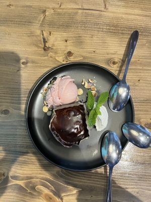 Chocolate lava cake with strawberry ice cream and coconut whipped creamm  at Bravocados in Tofino