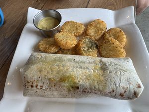 Brekky burrito, hashbrowns & side of hollandaise sauce   at Bravocados in Tofino