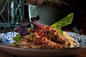 Smoked aubergines with mixed greens and crunchy veggie bacon at Herbario in Medellin