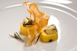 Weekly special -  corn cakes with blue cheese butter served with yuca cracklings at Herbario in Medellin