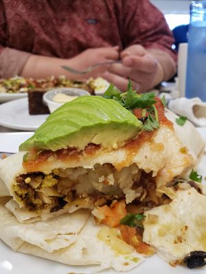 burrito: hashbrowns, tofu scramble, black beans, vegan chorizo, avo, salsa at Noble Restaurant in Wyoming