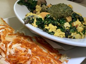 Vegan Scramble: Tofu & Vegan Egg Spice add Kale, Pineapple, Mushrooms, Onions, Vegan Basil Pesto w/ Hash Browns. at Noble Restaurant in Wyoming