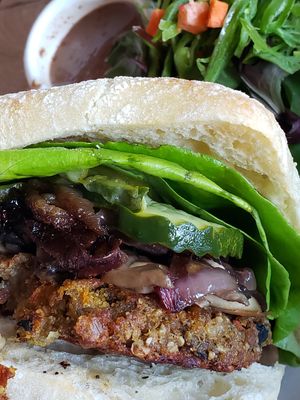 American burger w/ toppings of pickles, lettuce, mushrooms and grilled onions. at Hugo's Restaurant - Studio City in Studio City