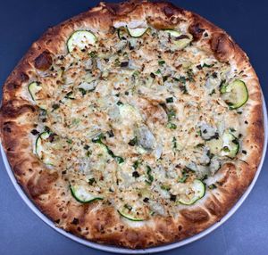 Vegan White 

House-made ranch sauce, zucchini, marinated artichokes, & green onions. at Buffalo Pizza and Ice Cream in Sacramento