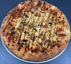Vegan Hawaiian Cowgirl

Red sauce, olives, pineapples, soysage, green onions, & with a drizzle of BBQ sauce at Buffalo Pizza and Ice Cream in Sacramento