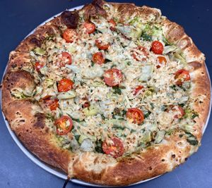 Vegan Pesto

House-made vegan pesto, tomatoes, & marinated artichokes at Buffalo Pizza and Ice Cream in Sacramento