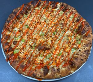 Vegan Buffalo

House-made ranch sauce, celery, carrot sticks, buffalo cauliflower, and with a drizzle of buffalo sauce.  at Buffalo Pizza and Ice Cream in Sacramento