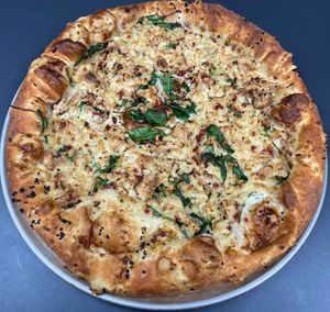 Vegan Garlic Chick'n

House-made ranch sauce, marinated chick'n, minced garlic, spinach, & topped with bac'un bits.  at Buffalo Pizza and Ice Cream in Sacramento