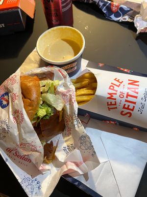 Temple deluxe “bacon & cheese” burger, fries, garlic sauce and cheese sauce at Temple of Seitan - Camden in North West London