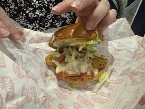 Inside of the Temple Burger - chicken, bacon, lettuce, pickles and sauce  at Temple of Seitan - Camden in North West London