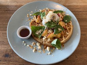 Peachy Keen (vegan sourdough waffle with peach, basil, crumbled macadamia, vegan ice cream and maple syrup) at Small Graces in Footscray