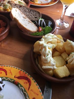Vegan vine leaves and vegan garlic mayo patatas bravas  at Tapas Tree in Bradford