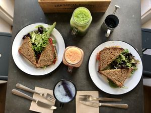 Forest and Tundra toasts, lite green juice, pink lemonade. Vanilla latte.  at Eight - The Health Lounge in Lisbon