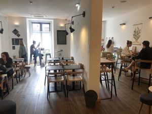 Upstairs seating with nice view of the square at Eight - The Health Lounge in Lisbon