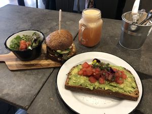 Temper burger, avocado toast and pink lemonade juice  at Eight - The Health Lounge in Lisbon