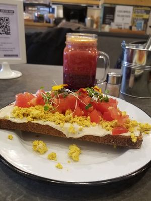 Toast with tofu scramble and AMAZING cashew cream cheese, and beet the orange juice at Eight - The Health Lounge in Lisbon