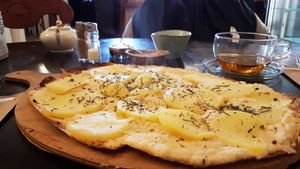 French pizza (Flammkuchen) with rosemary potatoes, really tasty at Anna's Cafe in Lueneburg
