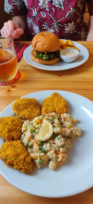 Burger, schnitzel with potato salad at Střecha in Prague