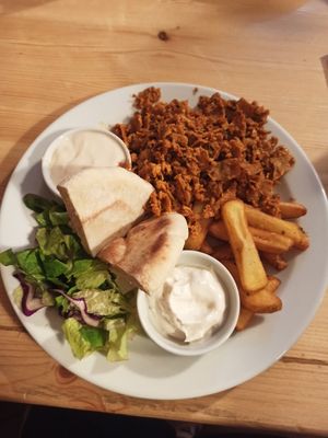Seitan kebab with pita, fries and dips at Střecha in Prague