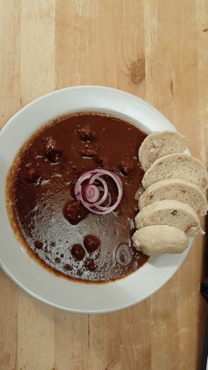 Dark beer goulash with bread dimplings at Střecha in Prague