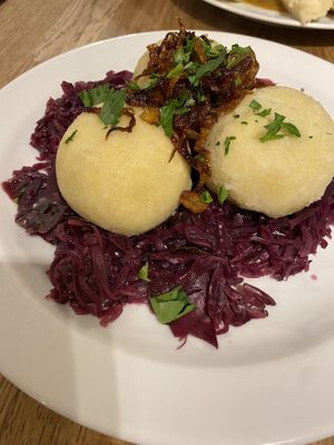 Very tasty filled dumplings with crispy onions on a bed or red cabbage. Tasty and filling.   at Střecha in Prague