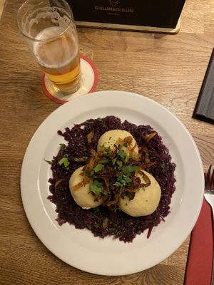 Dumplings filled with smoked soy on red cabbage   at Střecha in Prague