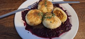 Vegan stuffed dumplings on red cabbage at Střecha in Prague