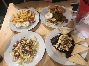 Grilled beetroot with vegan feta, salad, fries and kebab plate with hummus, pita and garlic dip at Střecha in Prague